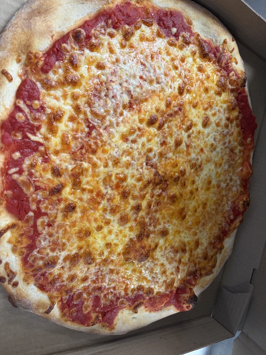 A fresh Cinelli's cheese pizza in its box
